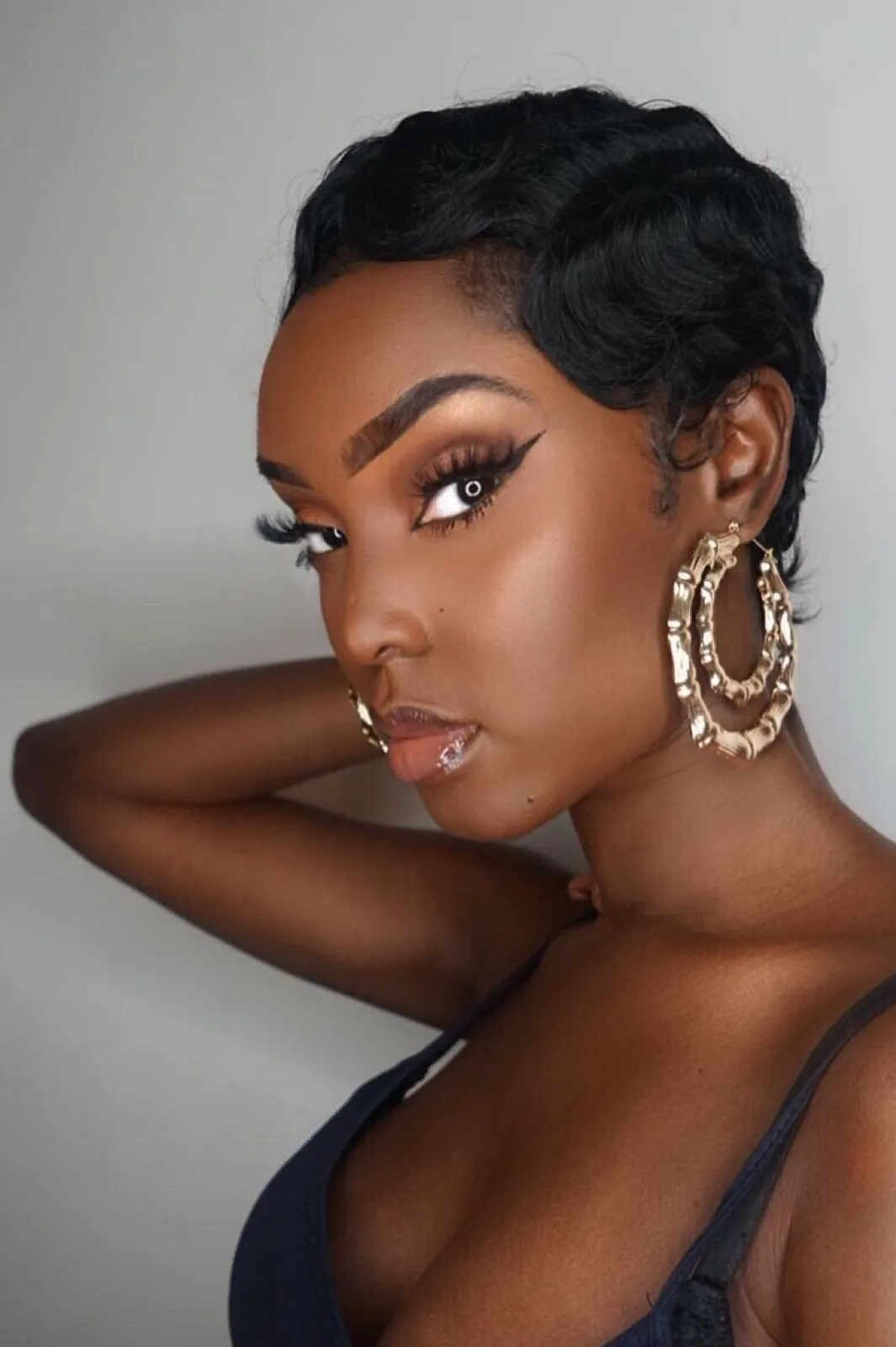 Pana: Black Short Curly Heat Resistant Synthetic Fibre Wig